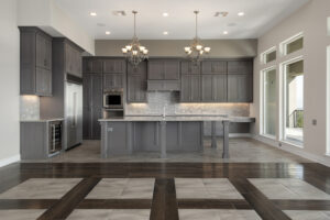 Custom kitchen interior with grey cabinetry