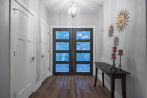 Door doors in entryway of custom home