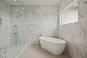 Bathtub and walk-in shower in custom home