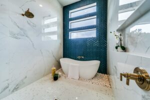 Luxury bathroom with standalone bathtub and blue backsplash