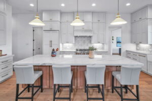 triple r luxury homes Custom luxury home san antonio kitchen dining room table hanging lights