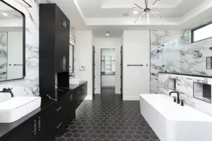 Luxury custom bathroom with black honeycomb floor and black marble counters