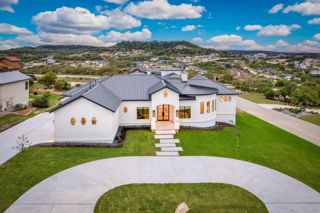 Aerial view of luxury home in San Antonio with a U-shaped driveway.